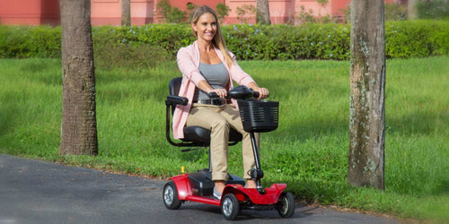 WOMAN RIDING SCOOTER